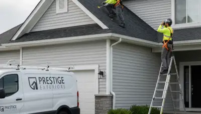 Professional roof inspection service in Minneapolis MN checking vinyl siding and shingles for damage